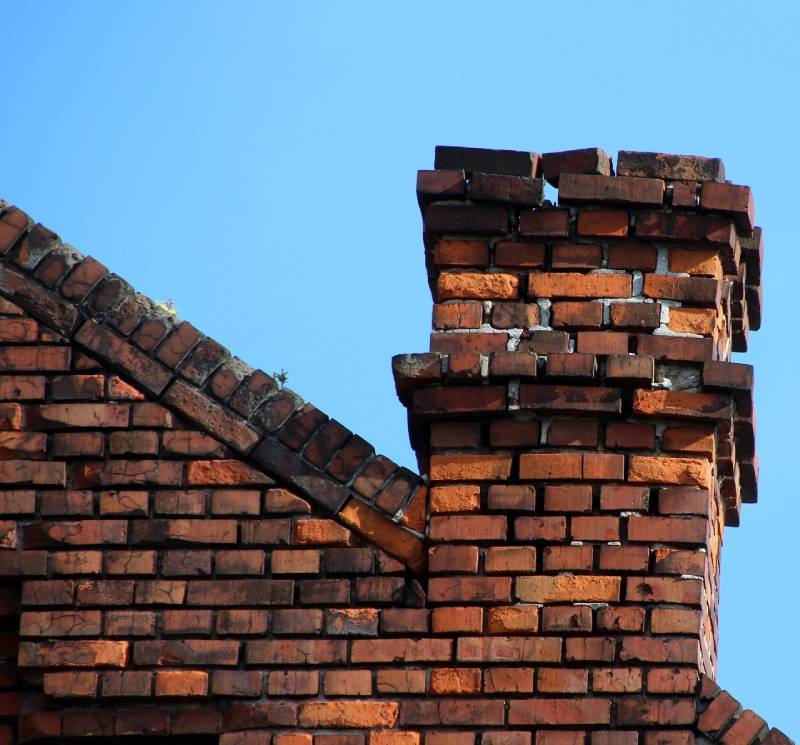 Signs Your Waltham Home Needs a Chimney Inspection Damaged chimney on an Waltham home showing cracks and missing mortar